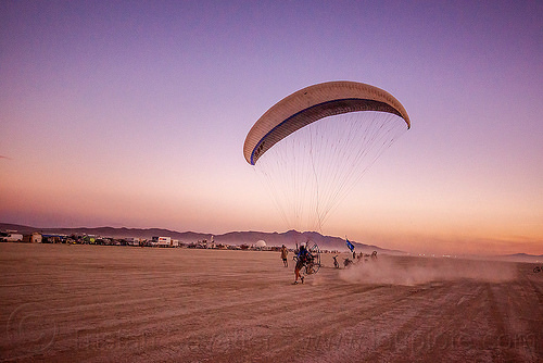 burning man - powered paraglider takeoff, brad gunnuscio, dusk, flying, man, paramotor, paramotoring, powered paraglider, powered paragliding