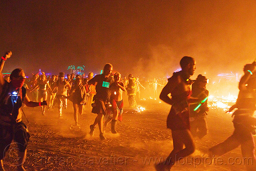 burning man - running melee around the man's burn, burning man at night, celebrating, crowd, dust, embers, fire, glowing, melee, mêlée, night of the burn, running, smoke