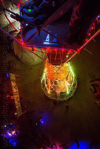 burning man - sextant tower crow nest at night, aerial photo, burning man at night, glowing, sextant camp, sextant tower, vertical