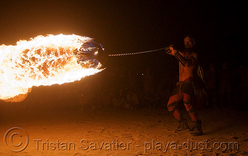 burning man - shanti (alex) spinning huge fire ball, burning man at night, fire ball, shanti alex