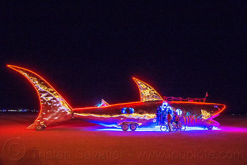 burning man - shark art car at night, burning man art cars, burning man at night, fish art car, glowing, mutant vehicles, shark art car