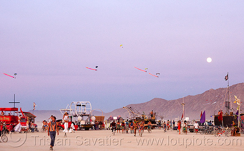 burning man - skydivers from the burning sky landing at dusk, burning sky, full moon, parachutes, parachutists, skydivers