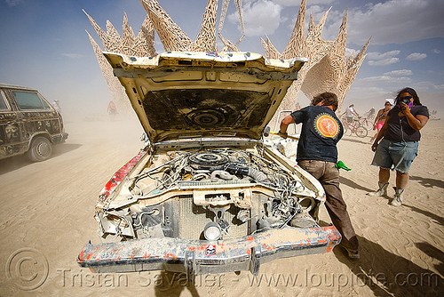 burning man - smashing a car, art car, burning man art cars, car engine, car hood, hammer, mutant vehicles, smashing, wreck, wrecking