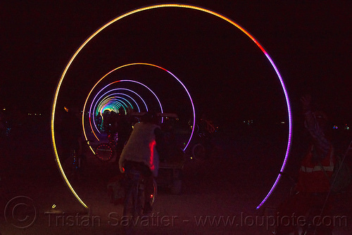 burning man - sonic runway, art installation, burning man at night, glowing, led light, light rings, vanishing point