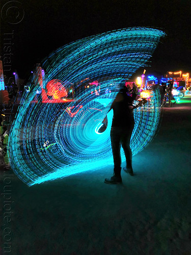 burning man - spinning a light wire, blue, burning man at night, glowing, light painting