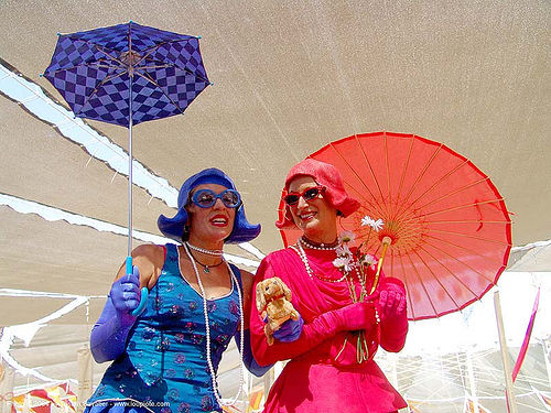 burning man - stiltwalkers with blue and red umbrellas, blue, costumes, girls, red, stiltwalkers, umbrellas, women