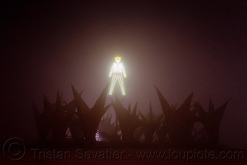 burning man - the man waiting to be torched - dust storm, burning man at night, dust storm, glowing, neon, playa dust, the man, whiteout