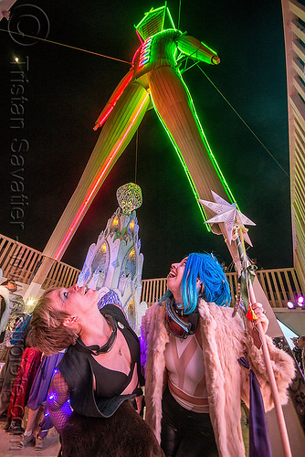 burning man - under the man at night, burning man at night, glowing, neon, the man, women