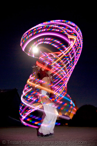burning man - woman spinning led hoop at night, burning man at night, full moon, glowing, hula hoop, led hoop, led lights, light hoop
