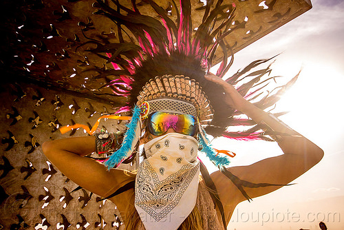 burning man - woman with tribal feather headdress, attire, bandana, burning man outfit, dust storm, face mask, feather headdress, feathers, pia, white out, windy, woman