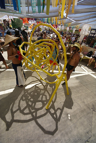 burning man - yellow maze sculpture in center camp cafe, yellow pipes