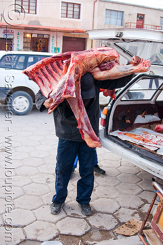 butcher carrying a quarter of beef - uyuni (bolivia), beef, bolivia, butcher, delivery, man, meat market, meat shop, raw meat, uyuni