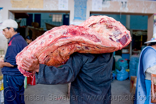 butcher carrying a quarter of beef - uyuni (bolivia), beef, bolivia, butcher, delivery, man, meat market, meat shop, uyuni
