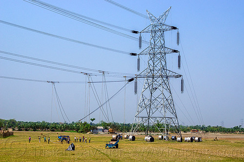 cable riggers installing power lines on transmission tower (india), cable riggers, cable wheels, cables, construction, electric line, electricity pylons, electricity transmission towers, high voltage, men, power line, power transmission lines, pulleys, pylon, rigging, ropes, wires, workers