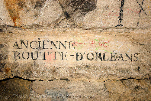 carved plate indicating road name - catacombes de paris - catacombs of paris (off-limit area), ancienne, cave, clandestines, d'orleans, d'orléans, illegal, new year's eve, plate, routte, sign, underground quarry
