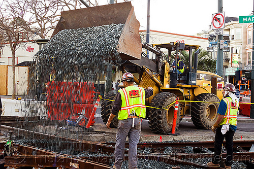 caterpillar cat it38g wheel loader, ballast, cat it38g, front loader, gravel, high-visibility jacket, high-visibility vest, light rail, man, muni, ntk, railroad construction, railroad tracks, railway tracks, reflective jacket, reflective vest, safety helmet, safety vest, san francisco municipal railway, track maintenance, track work, wheel loader, wheled loader, workers