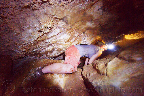 caver in a squeeze - clearwater cave - mulu (borneo), borneo, cavers, caving, clearwater cave system, clearwater connection, gunung mulu national park, malaysia, natural cave, spelunkers, spelunking, squeeze