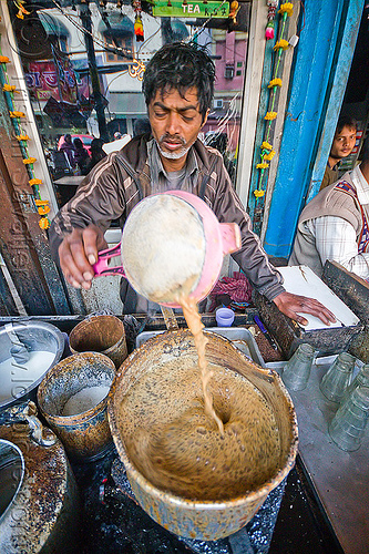 chai stall - preparing chai, boiling, chai stall, chai wallah, cooking, delhi, man, milk tea, paharganj, sift, spice tea, stove, street food, street seller, street vendor, tea stall