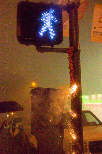chinese new year in chinatown (san francisco), backlight, chinatown bang, chinese new year, firecrackers, hanging, lunar new year, night, pyrotechnics, smoke, traffic light, walk sign