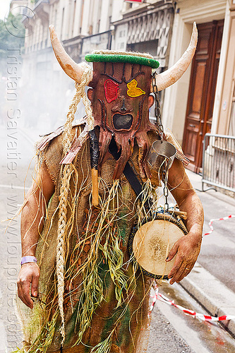 choukaj at the carnaval tropical de paris, caribbean, carnaval tropical, chain, choukaj, costumes, creole, créole, drum, guadeloupe, indigenous culture, man, mask, masked, parade, traditional, tribal, west indies
