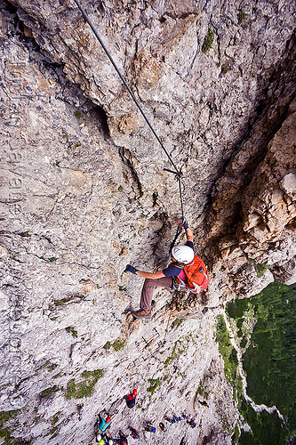 cliff climbing in the dolomites - via ferrata, alps, cliff, climber, climbing harness, climbing helmet, dolomites, dolomiti, ferrata tridentina, mountain climbing, mountaineer, mountaineering, mountains, rock climbing, vertical, via ferrata brigata tridentina, woman