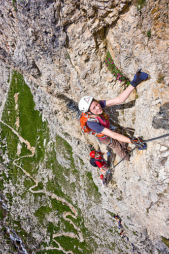 cliff climbing - via ferrata, alps, cliff, climber, climbing harness, climbing helmet, dolomites, dolomiti, ferrata tridentina, mountain climbing, mountaineer, mountaineering, mountains, rock climbing, vertical, via ferrata brigata tridentina, woman