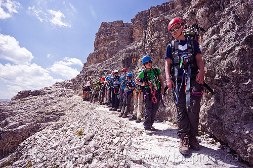 climbers in line - monte paterno via ferrata, alps, climbers, climbing harness, climbing helmet, dolomites, line, lined-up, montaineers, monte paterno, mountain climbing, mountaineer, mountaineering, mountains, parco naturale dolomiti di sesto, rock climbing, trail, via ferrata, waiting