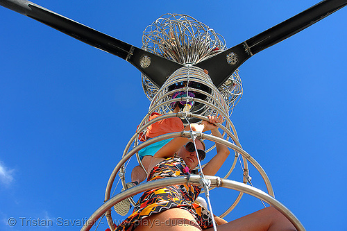 climbing inside a ring ladder - burning man 2006, art installation, cables, erica, ladder, michael christian, rings, three-legged alien