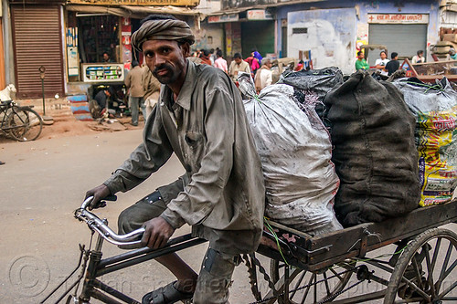 coal wallah delivering coal (india), bags, cargo tricycle, cargo trike, charcoal, coal, coalman, dirty, freight tricycle, freight trike, load bearer, man, moving, sacks, transport, transportation, transporting, varanasi, walking, wallah