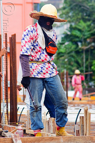construction worker - face mask and sun hat, borneo, building construction, concrete forms, concrete wall forms, construction site, construction workers, face mask, formwork, hammer, lumber, malaysia, man, miri, rebars, safety helmet, straw hat, sun hat, timber, walking