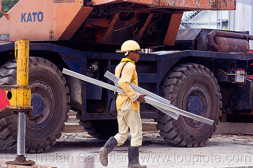 construction worker - kato mobile crane, borneo, building construction, construction site, construction workers, hydraulic cylinder, kato, malaysia, man, miri, mobile crane, safety helmet, tires, walking, working