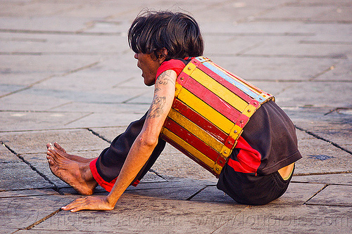 contortionist in barrel - street circus act (jakarta), contortionist, eid ul-fitr, fatahillah square, jakarta, man, street performer, taman fatahillah