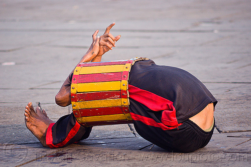 contortionist in barrel - street circus performer (jakarta), contortionist, eid ul-fitr, fatahillah square, indonesia, jakarta, man, street performer, taman fatahillah