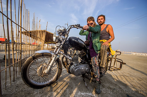 couple riding royal enfield bullet thunderbird motorcycle, 350cc, bun bun, fence, hindu pilgrimage, hinduism, kumbh mela, man, motorcycle touring, motorcyclists, rider, riding, royal enfield bullet, thunderbird, wojtek, woman