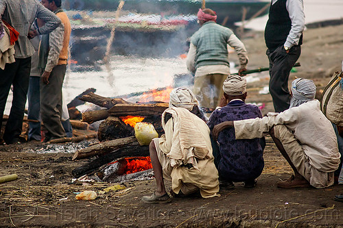 cremation of a dead person on a funeral pyre at harishchandra burning ghat - varanasi (india), burning ghat, corpse, cremation ghats, dead, fire, funeral pyre, ganga, ganges river, harishchandra ghat, hindu, hinduism, human cadaver, human remains, looking, men, river bank, sitting, smoke, smoking, squatting, varanasi