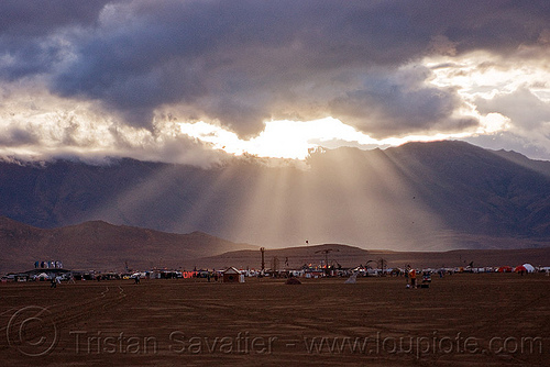 crepuscular rays and stormy sky over burning man 2010, cloudy sky, crepuscular rays, dusk, haze, hazy, landscape, stormy, sun light, sun rays through clouds
