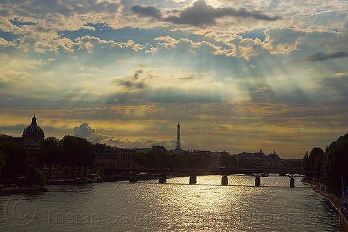 crepuscular rays over paris - river seine, backlight, bridge pillars, cloudy sky, crepuscular rays, eiffel tower, passerelle des arts, pont des arts, river, seine, sun light, sun rays through clouds