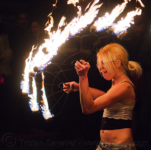 cressie mae with fire fans, american steel studios, cressie mae, fire dancer, fire dancing, fire fans, fire performer, fire spinning, holidays in flux, night, poplar gallery, spinning fire, woman