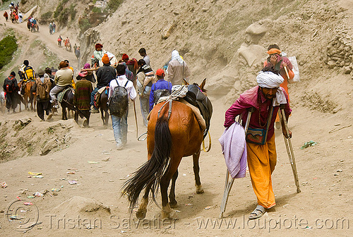 crippled hindu man with crutches and ponies on trail - amarnath yatra (pilgrimage) - kashmir, amarnath yatra, crippled, crutches, hindu pilgrimage, hinduism, kashmir, man, mountain trail, mountains, pilgrims, ponnies