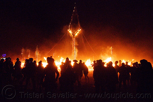 crowd around the burning man, burning man at night, crowd, night of the burn, the burning man, the man burning