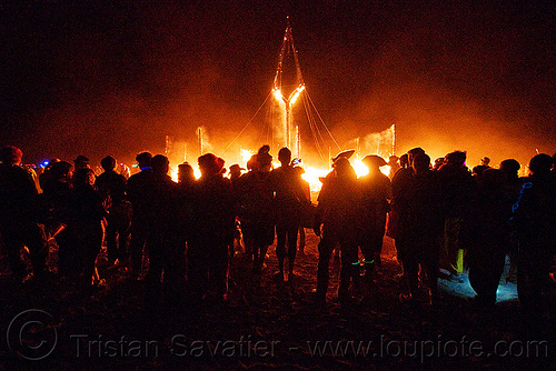 crowd around the burning man, burning man at night, crowd, night of the burn, the burning man, the man burning