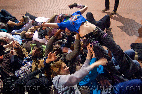 crowd-surfing at the great san francisco pillow fight 2009, crowd surfer, crowd surfing, down feathers, night, pillows, woman, world pillow fight day