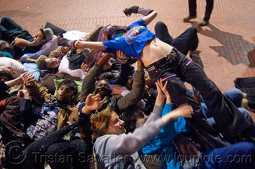 crowd-surfing at the great san francisco pillow fight 2009, crowd surfer, crowd surfing, down feathers, night, pillows, woman, world pillow fight day