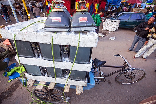 crt tubes on freight tricycle (india), cargo tricycle, cargo trike, cathodic ray tubes, crt, delhi, electronics, freight tricycle, freight trike, heavy, load, recycling, styrofoam, television, transport, transportation, transporting, tv screens