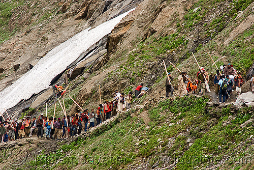 dandi / doli bearers with their sticks on the trail - amarnath yatra (pilgrimage) - kashmir, amarnath yatra, dandi, doli, hindu pilgrimage, kashmir, load bearers, mountain trail, mountains, pilgrims, snow, sticks, wallahs