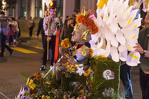 decorated aztec statue - dia de los muertos procession (san francisco), aztec sculpture, calla lilies, day of the dead, decorated, dia de los muertos, flower crown, halloween, night, orange flowers, orange marigold, statue