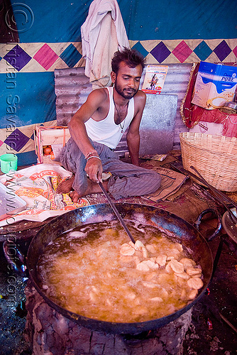 deep-frying - langar (free community kitchen) - amarnath yatra (pilgrimage) - kashmir, amarnath yatra, cooking oil, cooks, deep-frying, food, hindu pilgrimage, india, kashmir, kitchen, langar, man, sikh, sikhism, wok