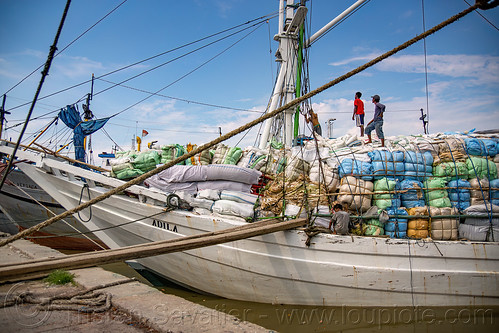 docked bugis schooner "adila" loaded with goods - traditional wooden cargo boat, adila, boats, bugis schooners, dock, harbor, man, pinisi, ships, surabaya
