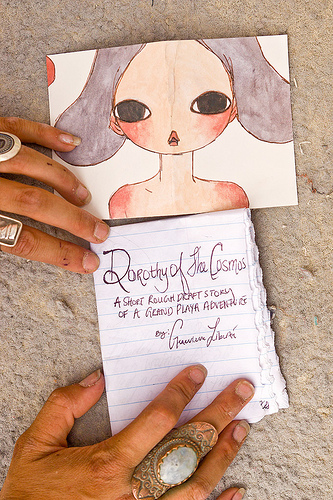 dorothy of the cosmos, page 0 of 11 - burning man 2013, burning man, dorothy of the cosmos, genevieve liberté, hands, handwriting, jewelry, page, paper, ring, short story, writing