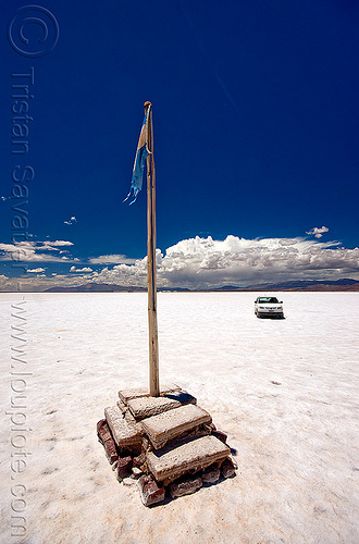 driving on a salt flat - salinas grandes - salar (argentina), argentina, blue sky, car, flag pole, halite, horizon, jujuy, noroeste argentino, rock salt, salar, salinas grandes, salt bed, salt flats, salt lake, white